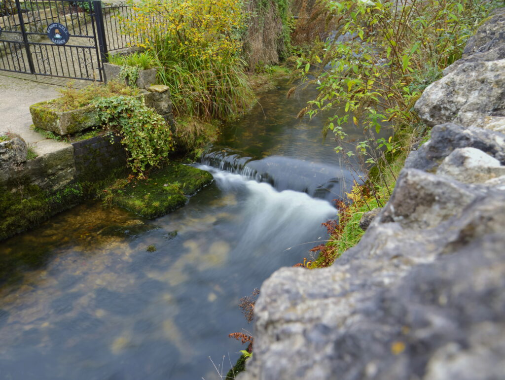 A river with mossy walls enclosing it
