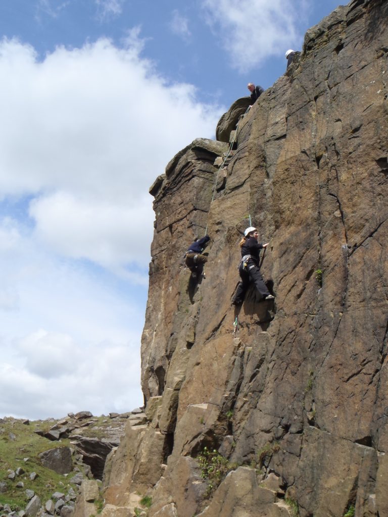 2 rock climbers on a rock face