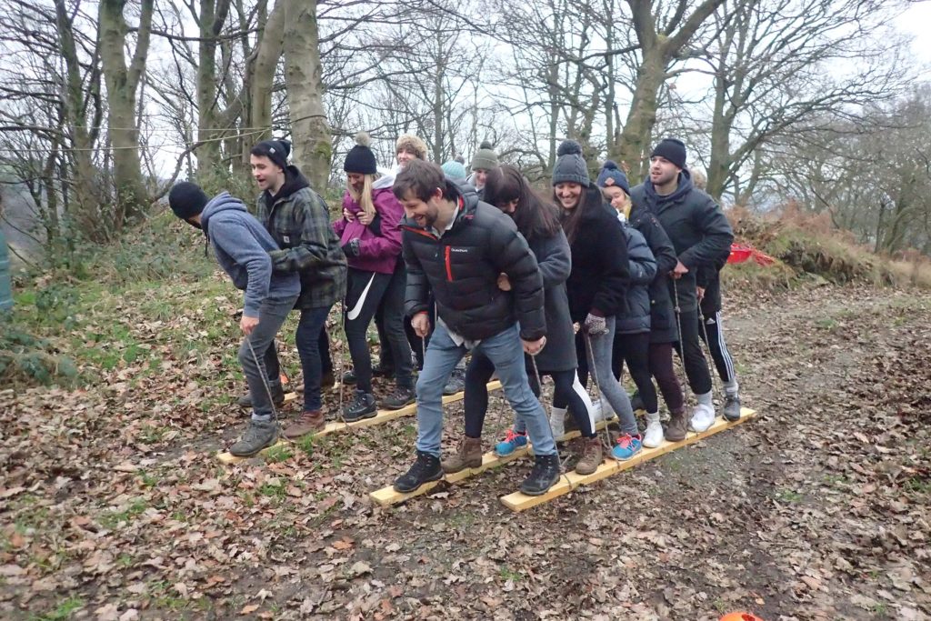 A large group taking park in a competitive Team Building game